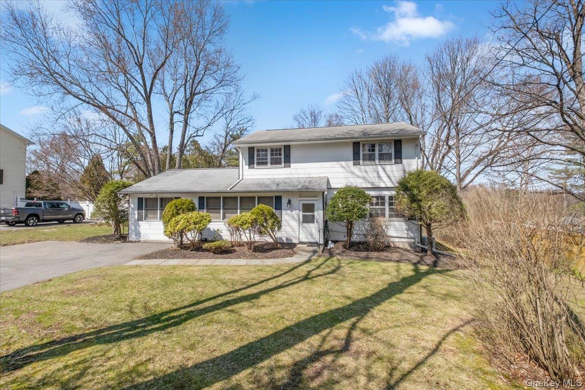 496 Granite Springs Road Yorktown Heights, NY 10598 - Photo 5 of 43 a front view of a house with a yard