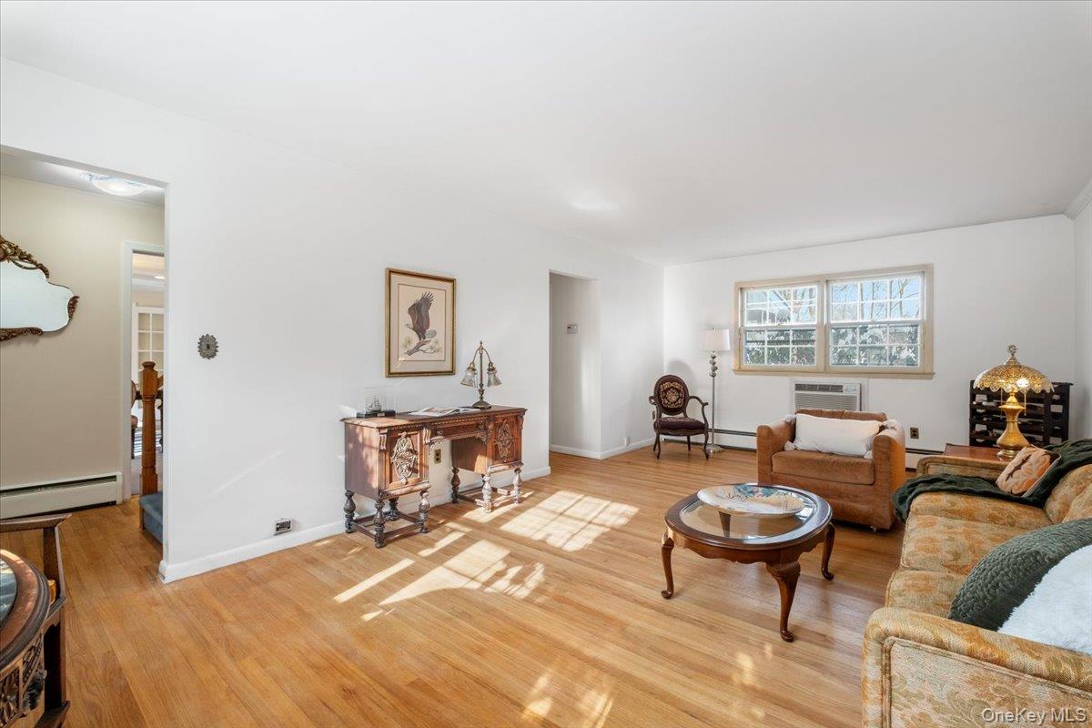 496 Granite Springs Road Yorktown Heights, NY 10598 - Photo 10 of 43 a living room with furniture a table and a window