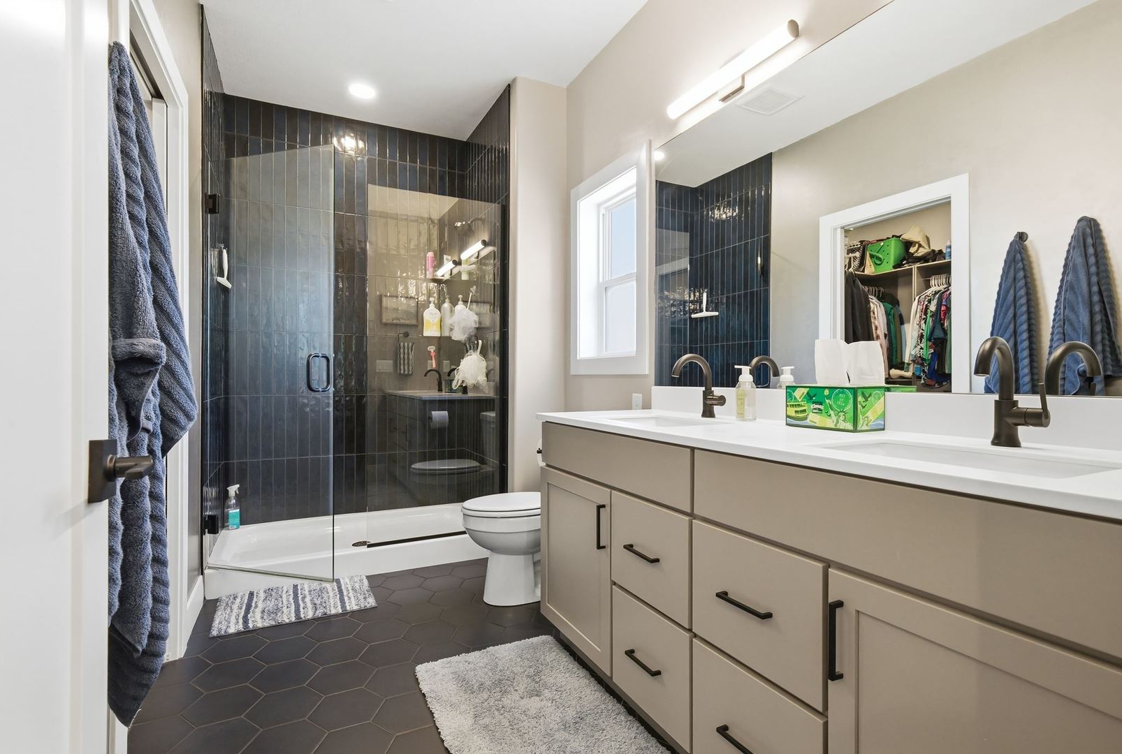 1216 Granite Way Normal, IL 61761 - Photo 18 of 33 a bathroom with a double vanity sink toilet and shower