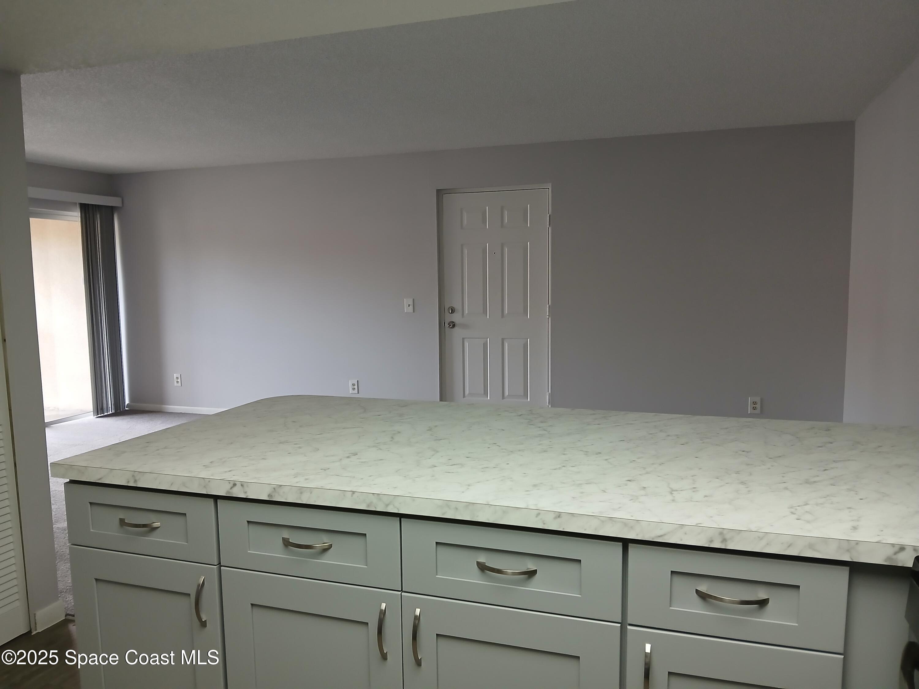 1648 Sunny Brook Lane, Unit M205 Palm Bay, FL 32905 - Photo 5 of 11 Kit to Living Area