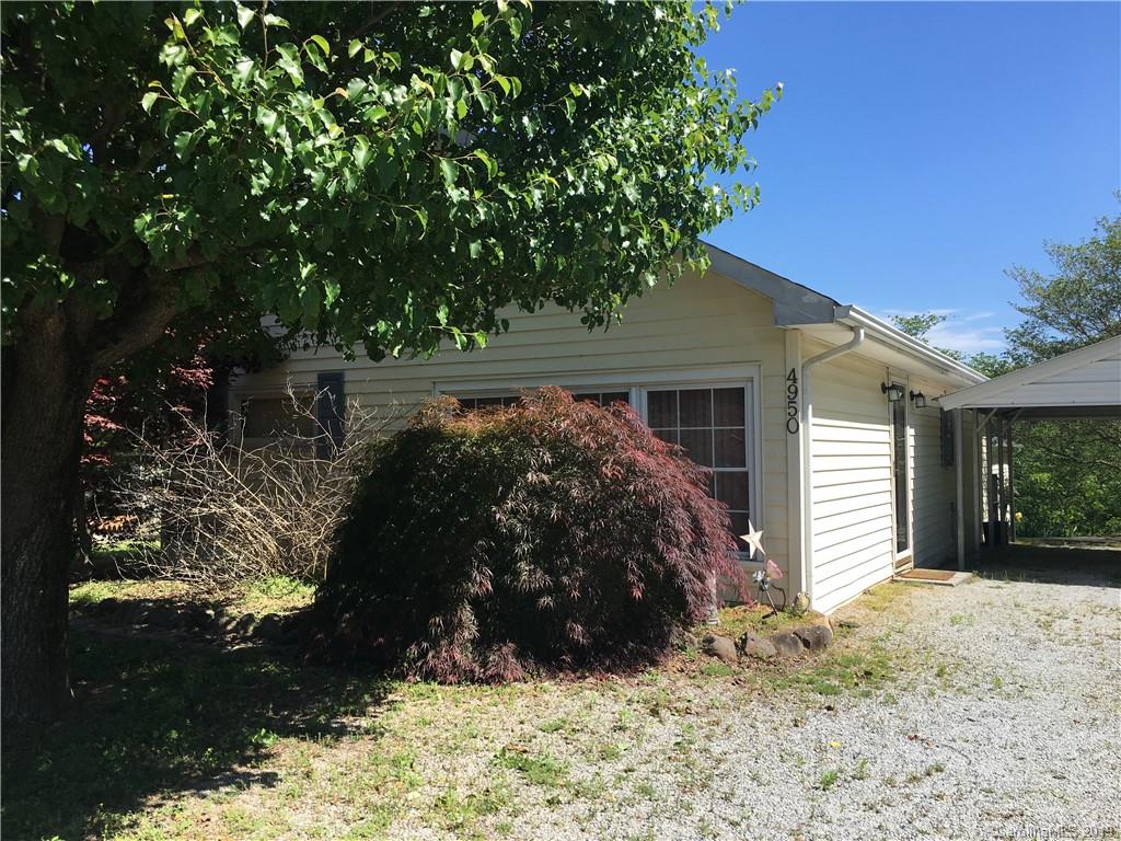 4950 Woodleaf Road Salisbury, NC 28147 - Photo 2 of 10 a view of a house with a yard