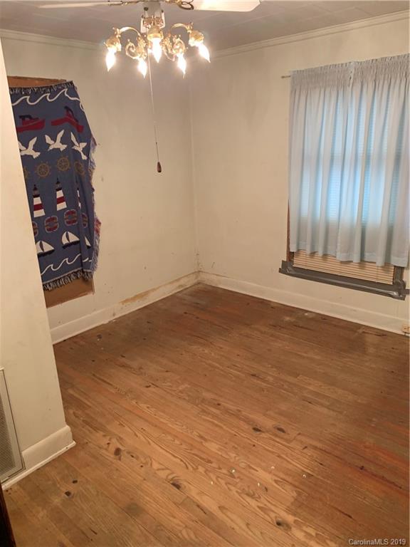 4950 Woodleaf Road Salisbury, NC 28147 - Photo 3 of 10 wooden floor in an empty room with a window