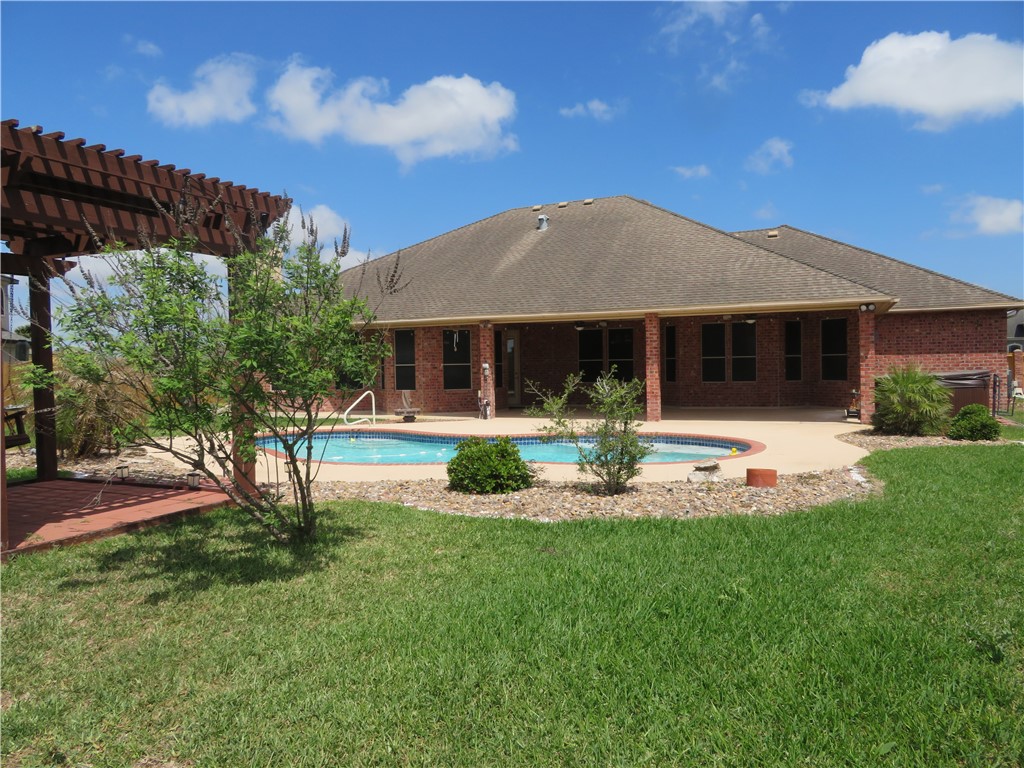 5803 South Oso Parkway Corpus Christi, TX 78414 - Photo 37 of 39 a front view of a house with swimming pool and porch with furniture