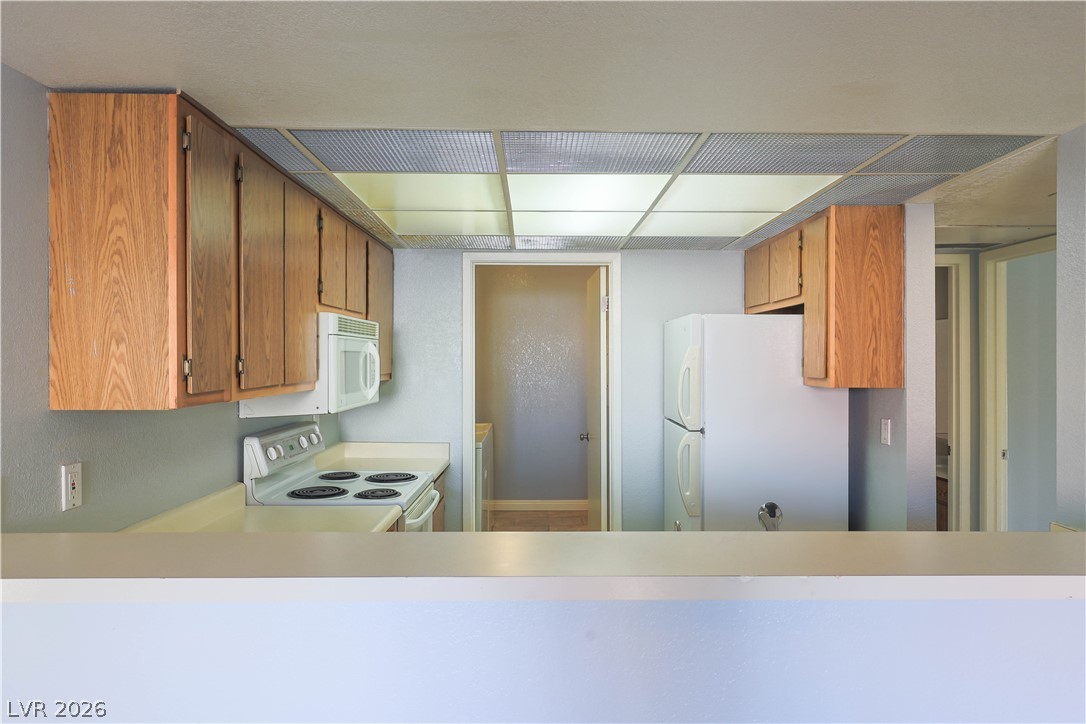 6750 Del Rey Avenue, Unit 267 Las Vegas, NV 89146 - Photo 13 of 20 Functional kitchen with ample cabinetry and essential appliances awaits your personal touch.