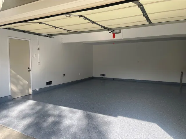 a view of a swimming pool with lawn chairs and couches