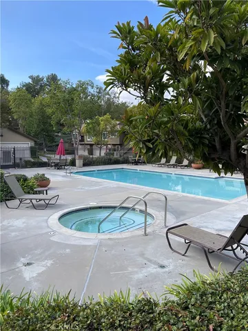 a view of a chair and table on the deck