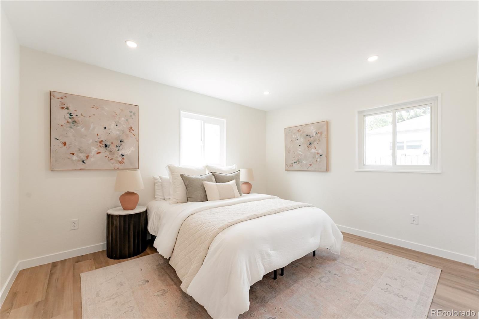 1279 South Raritan Street Denver, CO 80223 - Photo 14 of 25 a bedroom with a bed and a window