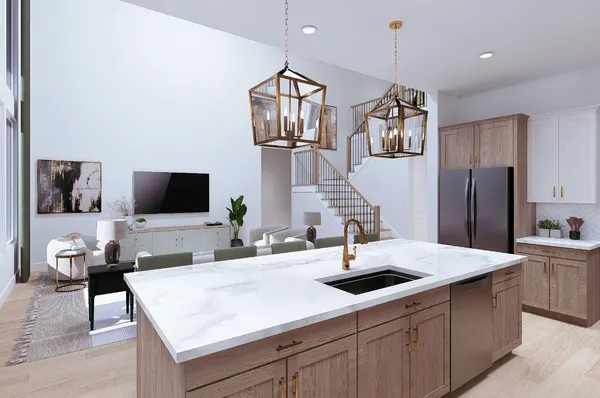 a kitchen with stainless steel appliances a sink and a refrigerator