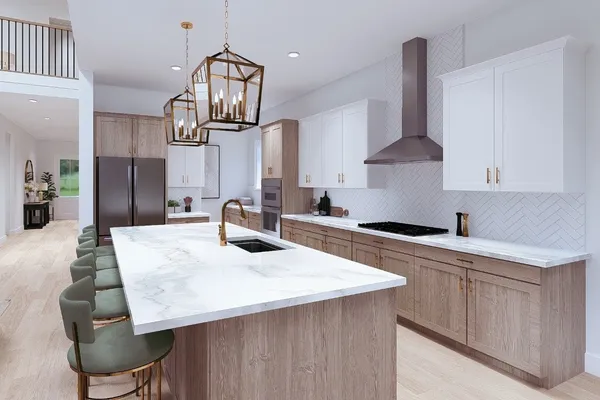 a kitchen with stainless steel appliances a table chairs in it and wooden floors