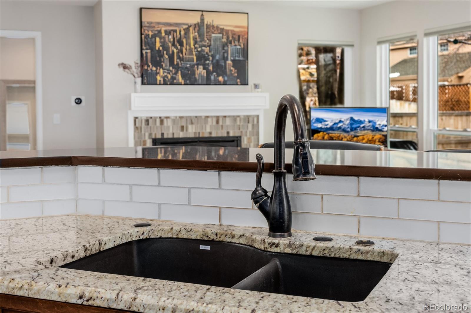 8827 South Cactus Flower Way Highlands Ranch, CO 80126 - Photo 17 of 49 a bathroom with a granite countertop sink a mirror and bathtub