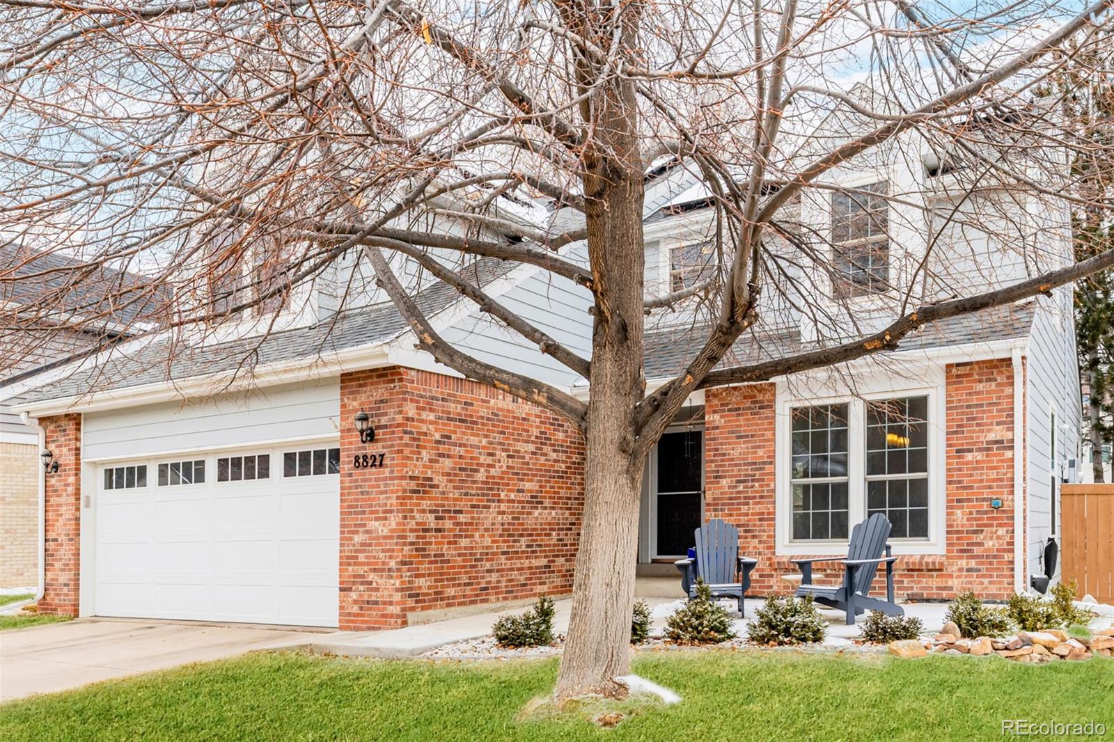 8827 South Cactus Flower Way Highlands Ranch, CO 80126 - Photo 2 of 49 a front view of house with yard