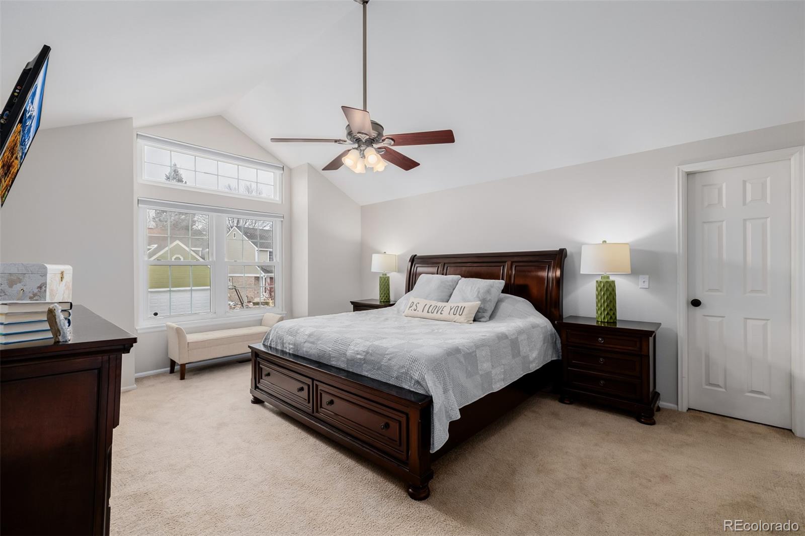 8827 South Cactus Flower Way Highlands Ranch, CO 80126 - Photo 24 of 49 a spacious bedroom with a bed a chandelier and a window