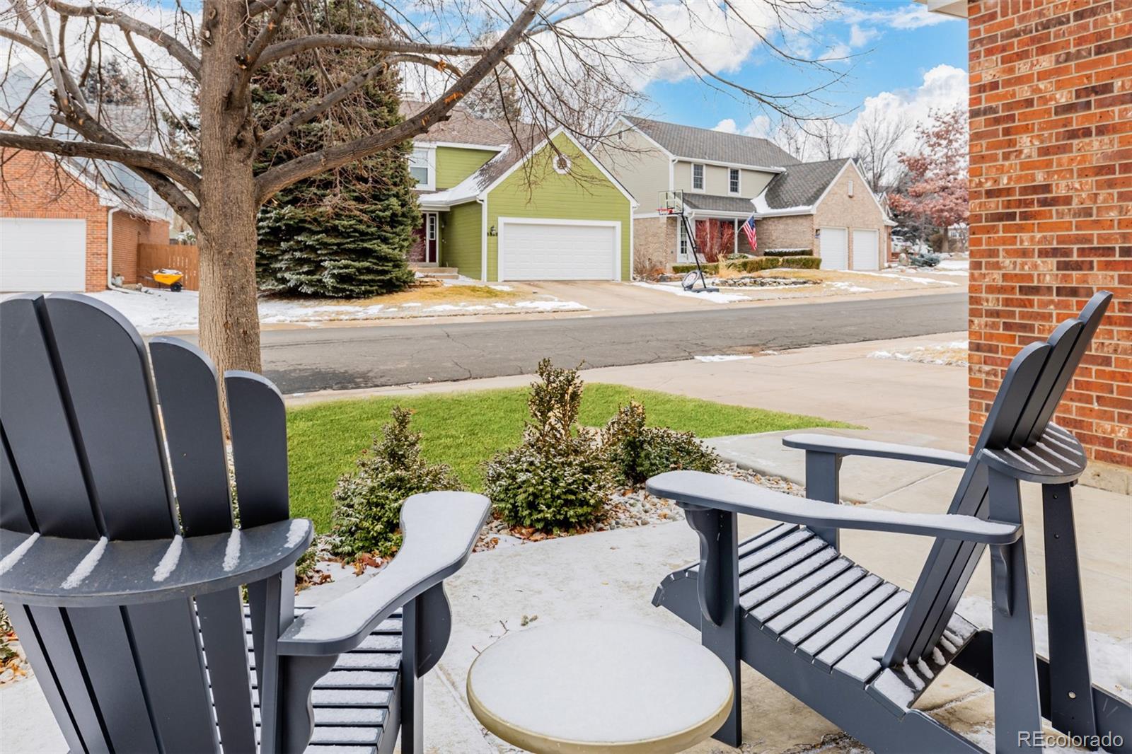 8827 South Cactus Flower Way Highlands Ranch, CO 80126 - Photo 3 of 49 a view of an chairs and table in the patio