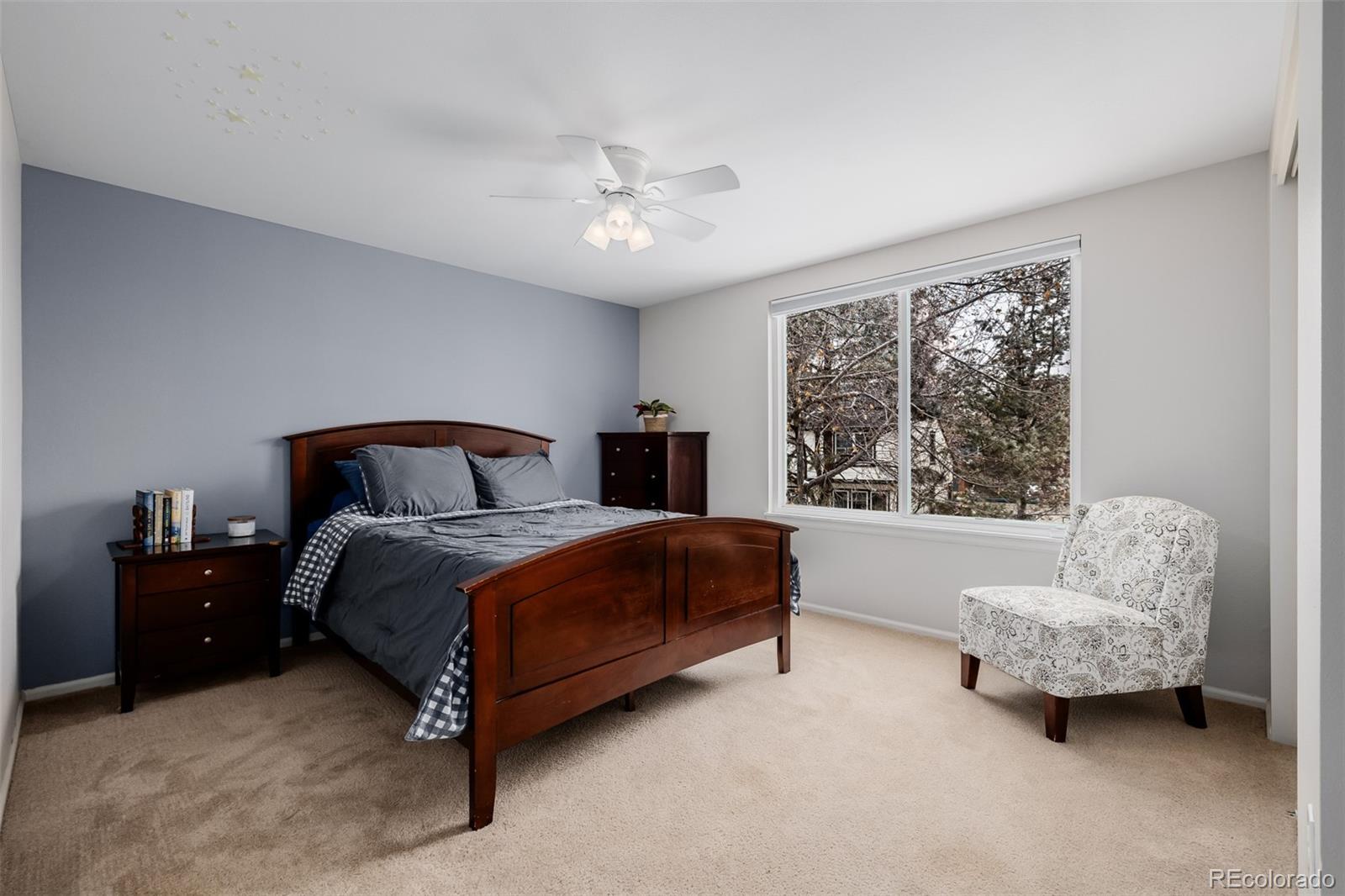 8827 South Cactus Flower Way Highlands Ranch, CO 80126 - Photo 32 of 49 a bedroom with a bed and a couch