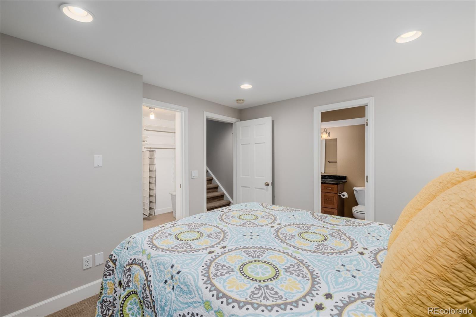 8827 South Cactus Flower Way Highlands Ranch, CO 80126 - Photo 38 of 49 a bedroom with a bed and a dresser