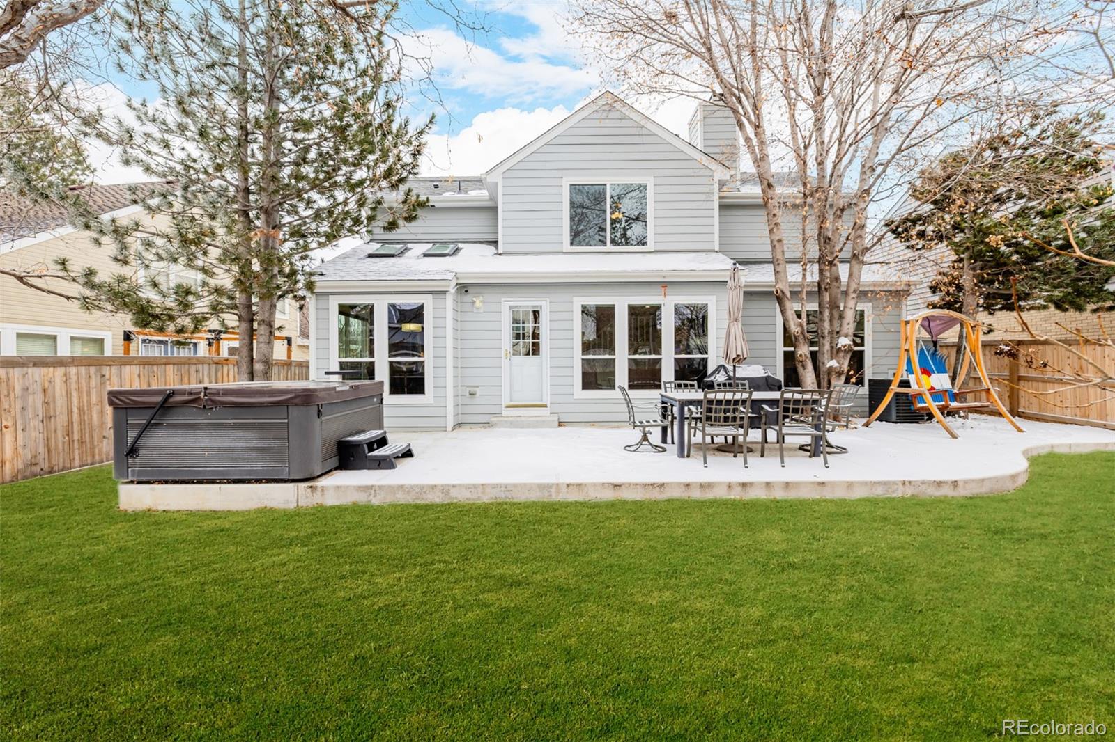 8827 South Cactus Flower Way Highlands Ranch, CO 80126 - Photo 46 of 49 a view of a house with furniture and a yard