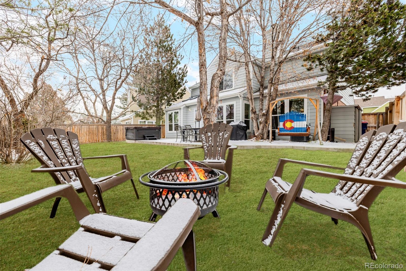 8827 South Cactus Flower Way Highlands Ranch, CO 80126 - Photo 47 of 49 a view of a chairs and table in backyard of the house