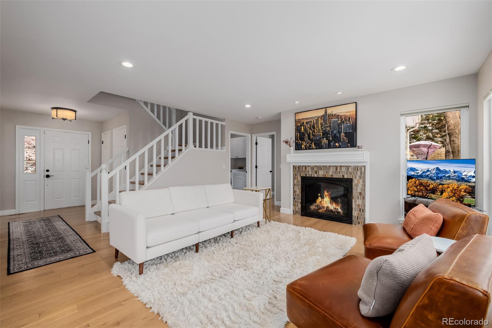 8827 South Cactus Flower Way Highlands Ranch, CO 80126 - Photo 6 of 49 a living room with furniture and a fireplace