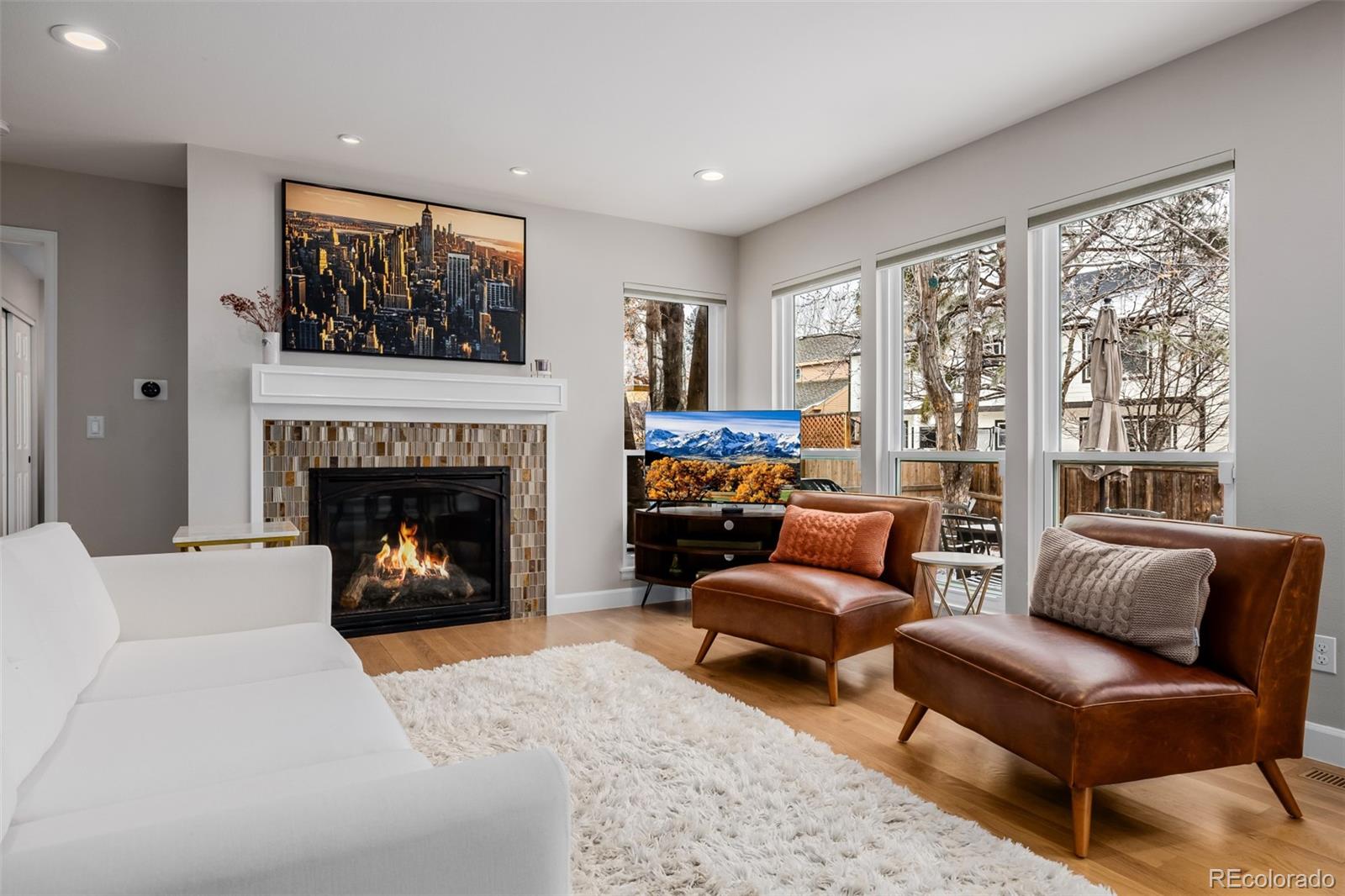 8827 South Cactus Flower Way Highlands Ranch, CO 80126 - Photo 7 of 49 a living room with furniture and a fireplace
