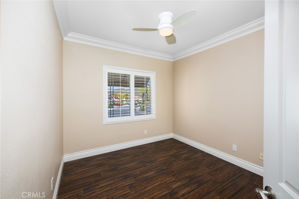 29 Beaulieu Lane Lake Forest, CA 92610 - Photo 29 of 60 an empty room with wooden floor and windows