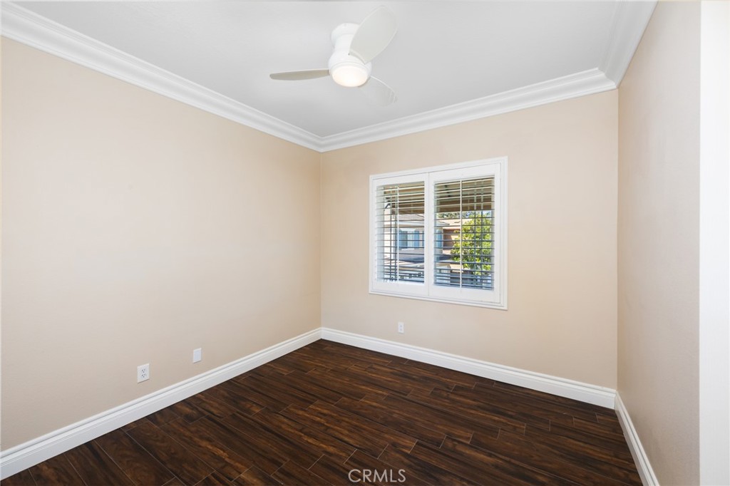 29 Beaulieu Lane Lake Forest, CA 92610 - Photo 30 of 60 an empty room with wooden floor and windows