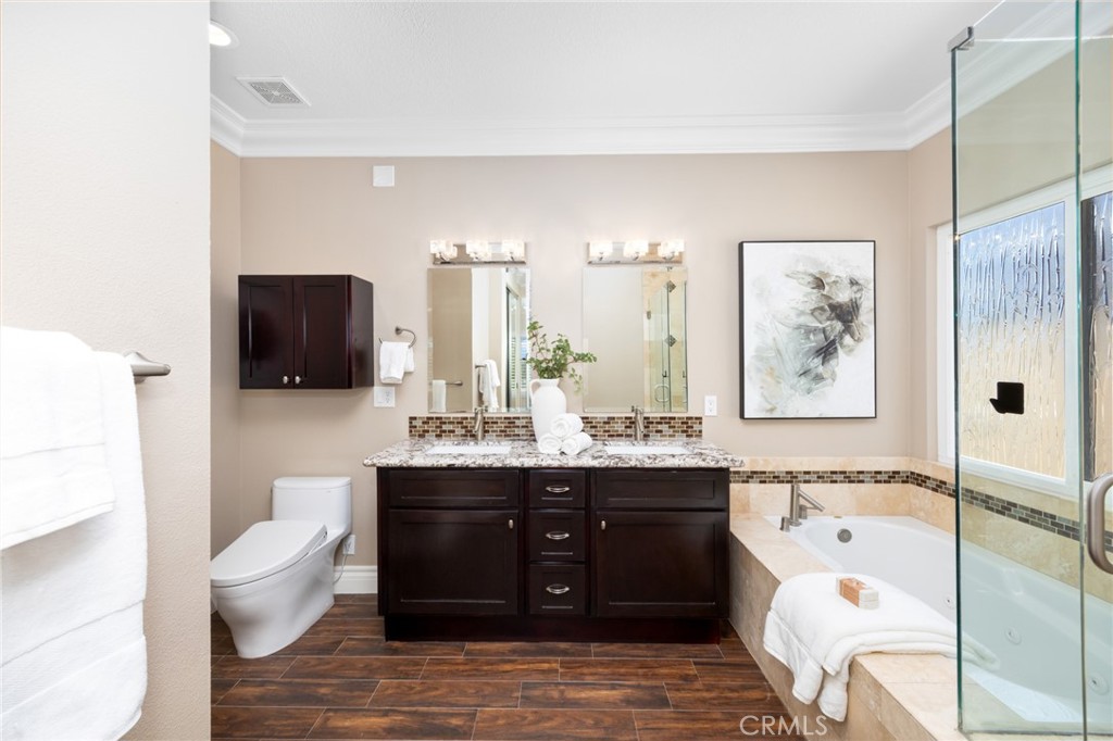 29 Beaulieu Lane Lake Forest, CA 92610 - Photo 36 of 60 a spacious bathroom with a bathtub shower sink and toilet