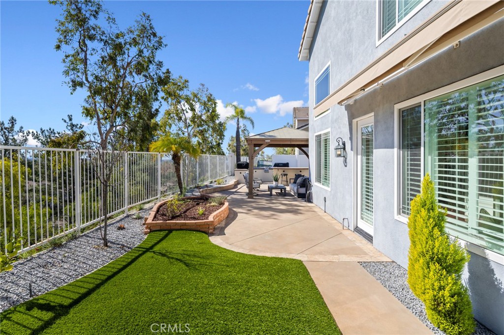 29 Beaulieu Lane Lake Forest, CA 92610 - Photo 41 of 60 a view of a backyard with couches plants and large trees