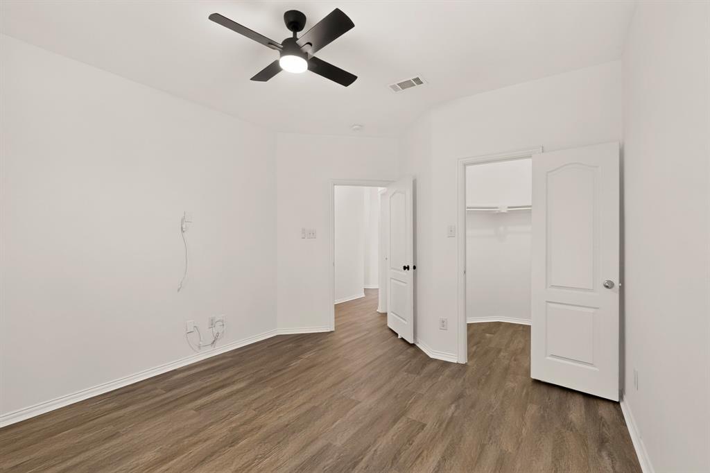 14908 Riverside Drive Little Elm, TX 75068 - Photo 28 of 40 Wood-finish flooring with crisp white walls and white trim