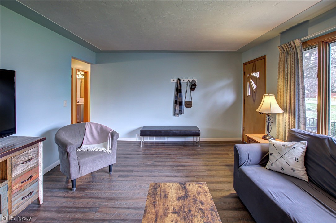 39974 Butternut Ridge Road Elyria, OH 44035 - Photo 13 of 40 Living room with plenty of natural light and dark wood-type flooring