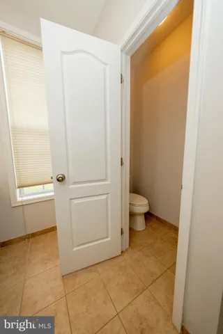 a bathroom with a granite countertop sink