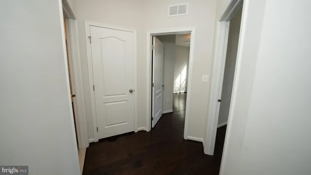 an empty room with wooden floor