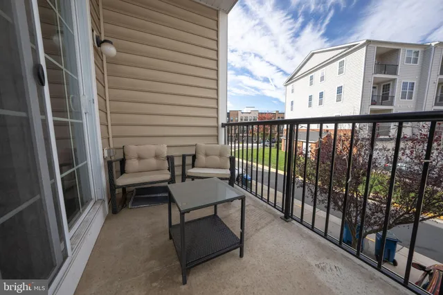 a view of a balcony with chairs