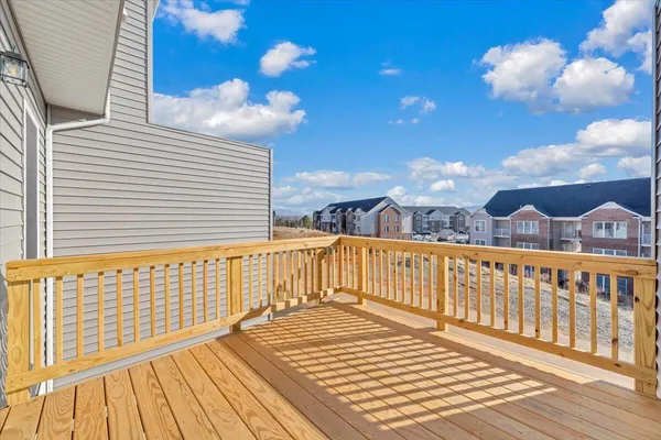 a view of a balcony with wooden floor