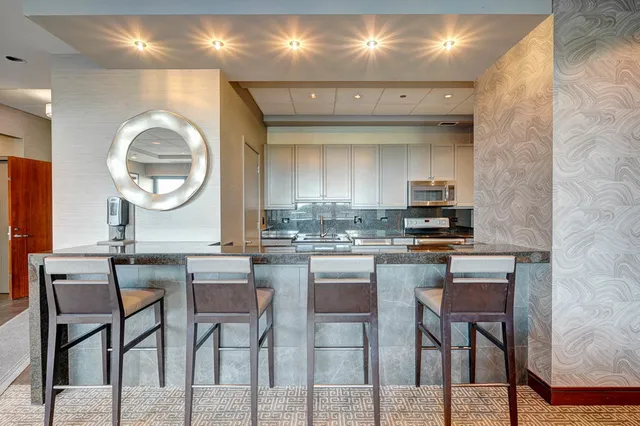 a bedroom view with a balcony a bed and wooden floor