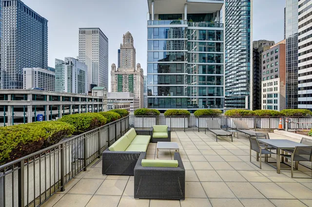 a view of a terrace with furniture and stove