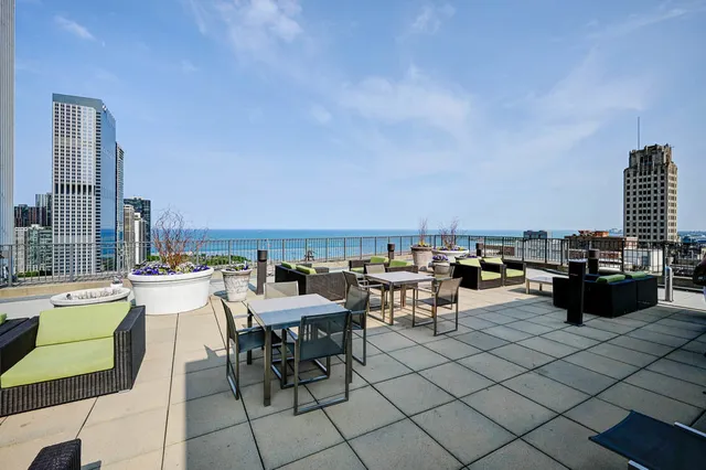 a kitchen with stainless steel appliances kitchen island granite countertop a sink stove and cabinets