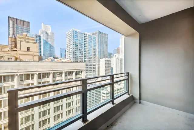 a view of a large building from a balcony