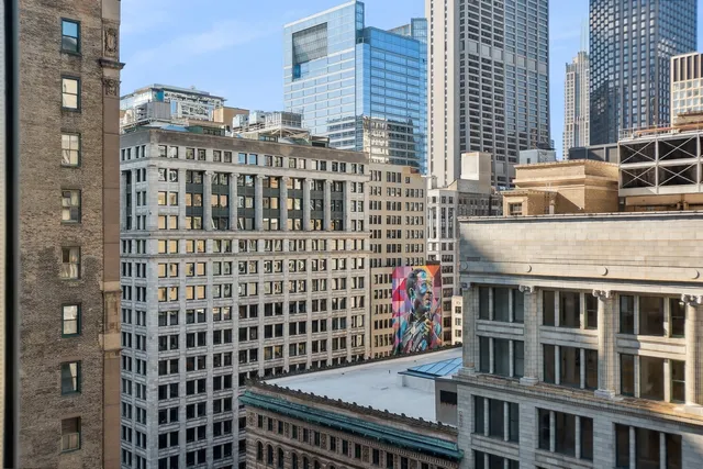 a bedroom with a large bed and a large window