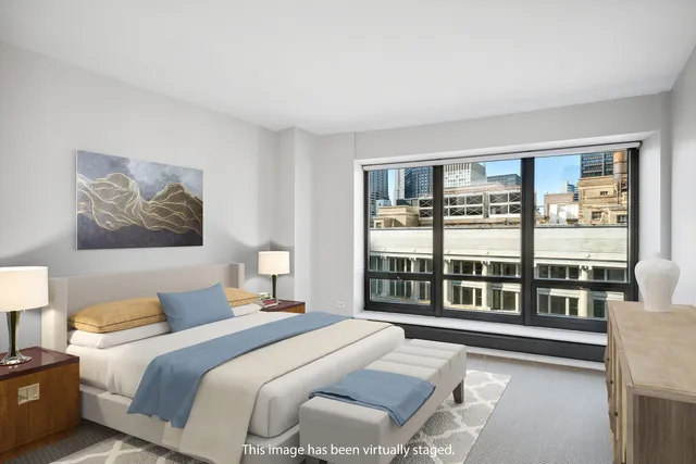 a bathroom with a granite countertop sink a toilet and a mirror
