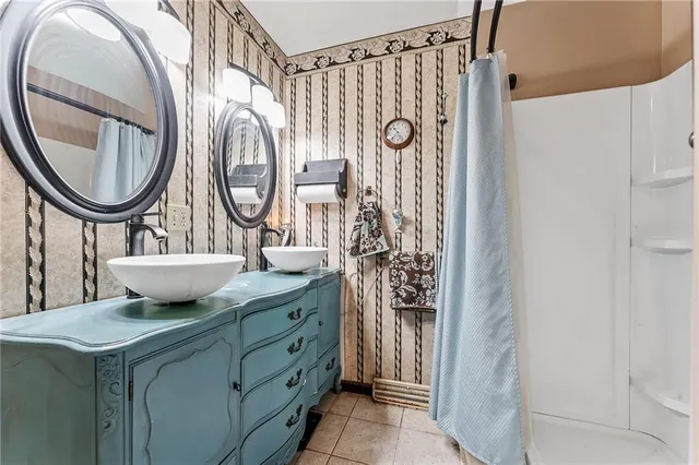 a bathroom with a mirror and a sink