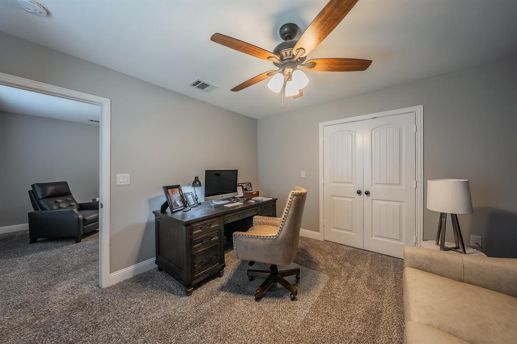 117 Rock Salt Drive Springtown, TX 76082 - Photo 26 of 38 Well-appointed room featuring grey wall paint, plush carpet flooring, a ceiling fan with light fixture, and white double doors with black hardware