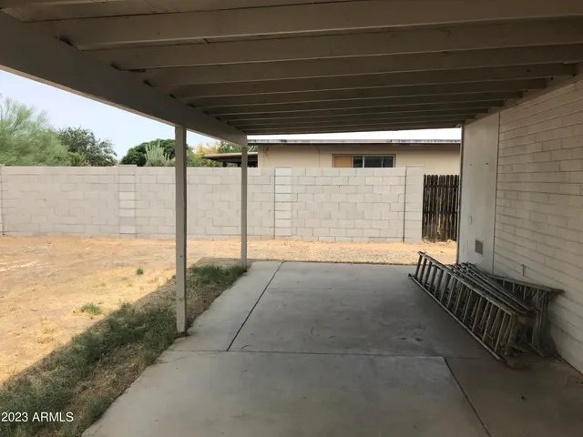 a view of backyard with tub