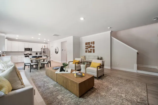 a living room with furniture and a table