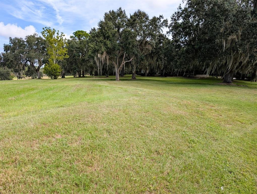 7505 Southwest 35th Way Gainesville, FL 32608 - Photo 3 of 7 a view of outdoor space with deck and yard