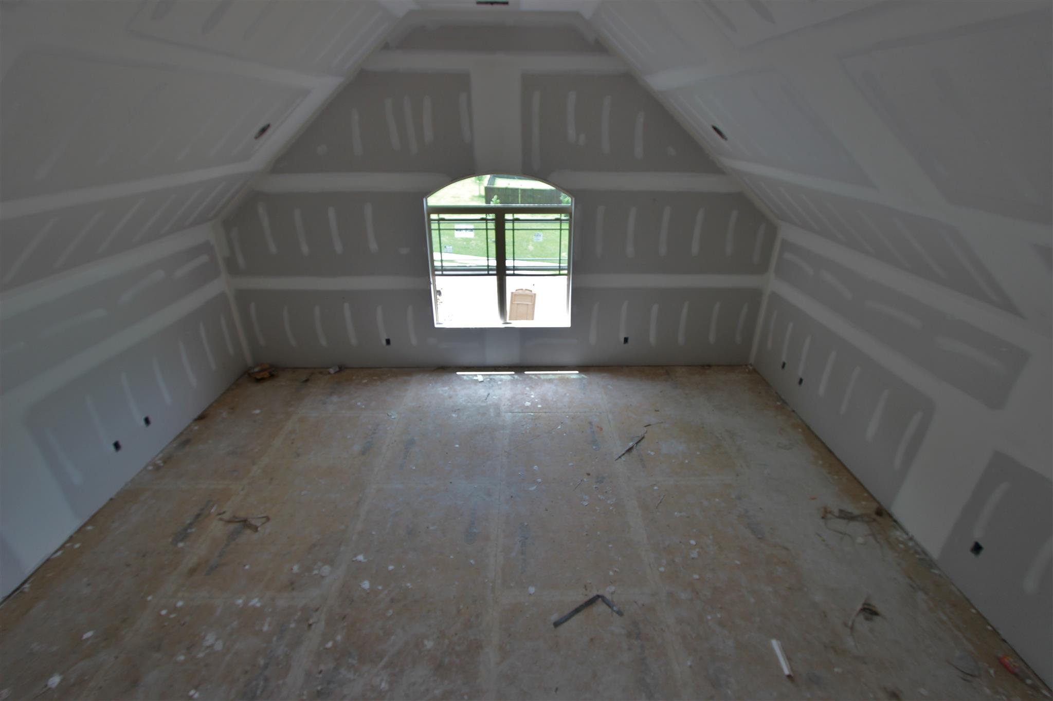 49 Remington Road Lebanon, TN 37090 - Photo 16 of 22 a view of a big room with windows and chandelier fan