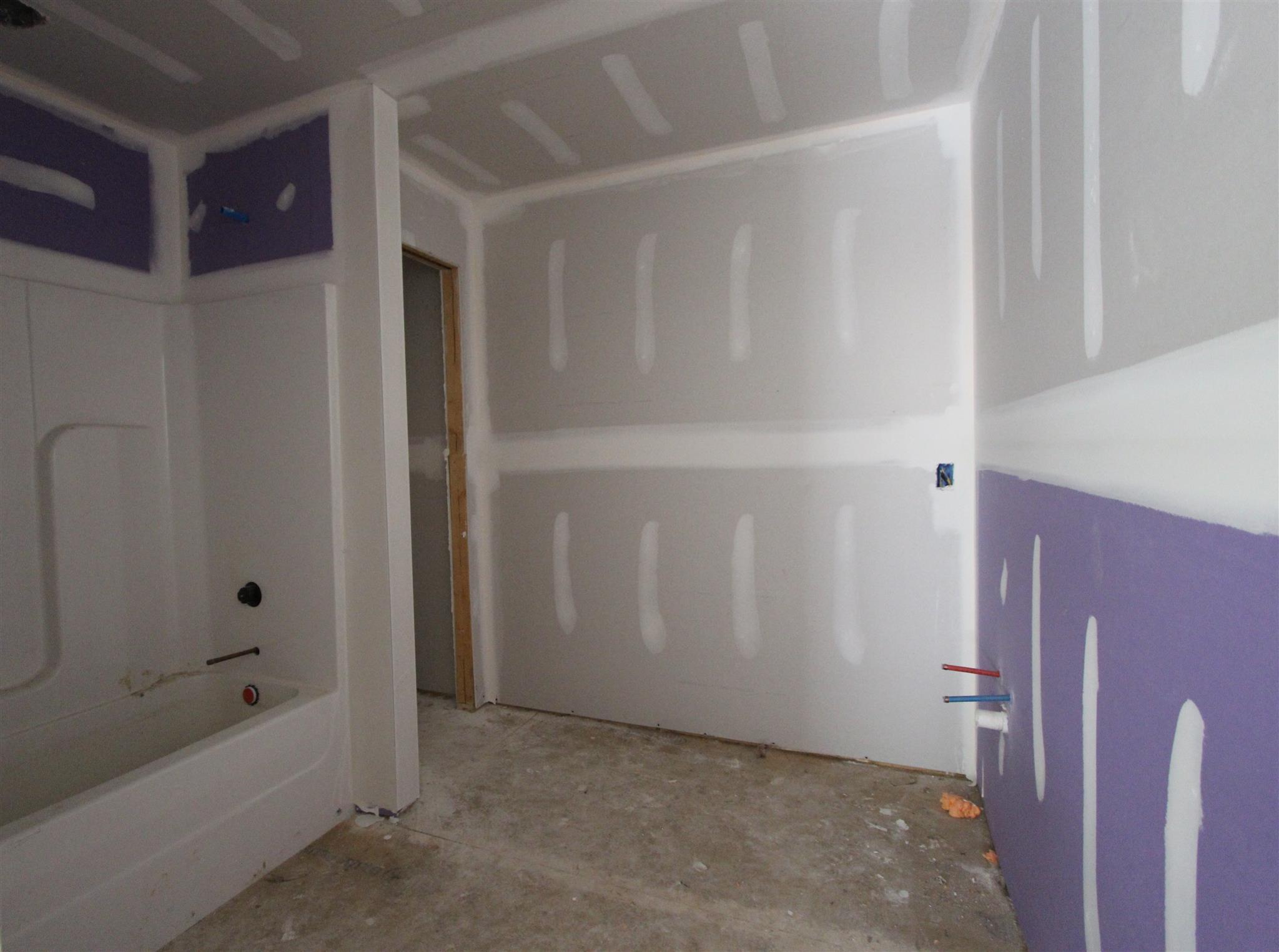 49 Remington Road Lebanon, TN 37090 - Photo 18 of 22 a bathroom with a bathtub and shower