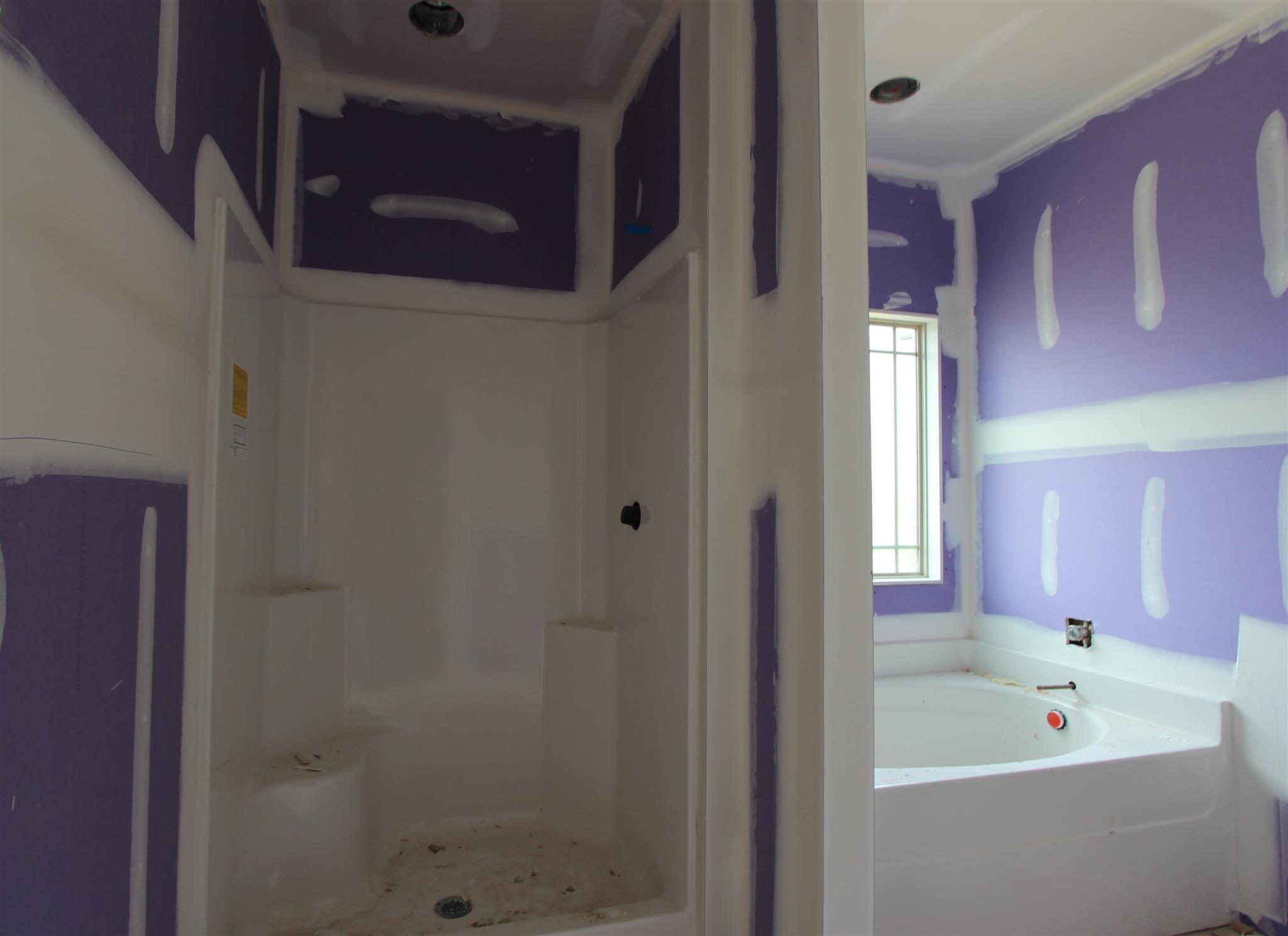 49 Remington Road Lebanon, TN 37090 - Photo 10 of 22 a bathroom with a tub shower and sink