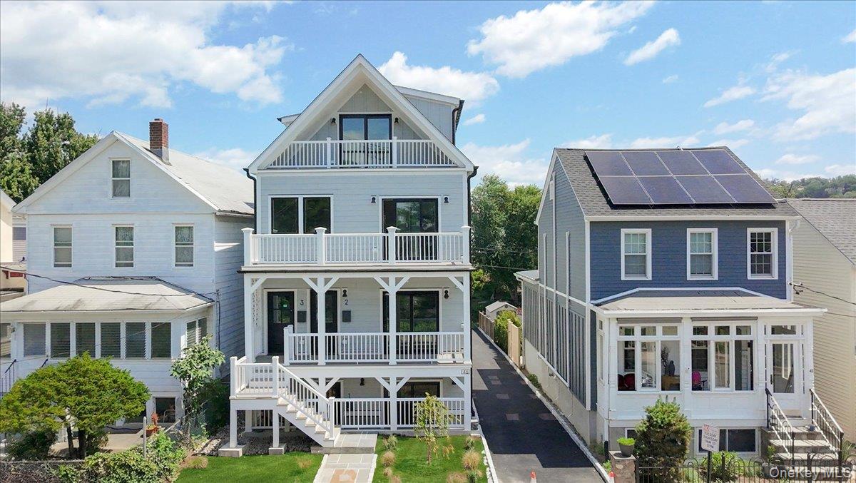 46 Hudson Street, Unit 1 Sleepy Hollow, NY 10591 - Photo 1 of 31 a front view of a house with a yard