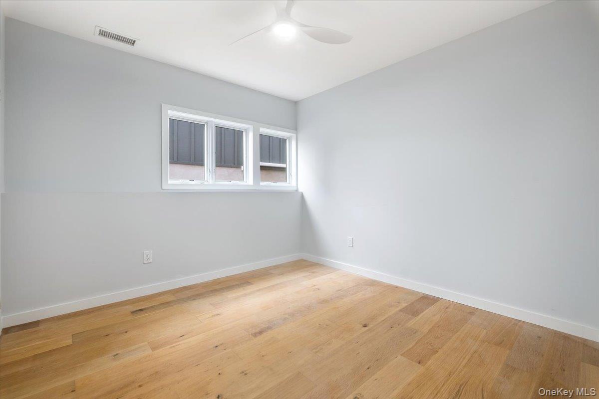 46 Hudson Street, Unit 1 Sleepy Hollow, NY 10591 - Photo 15 of 31 a view of an empty room with wooden floor and a window