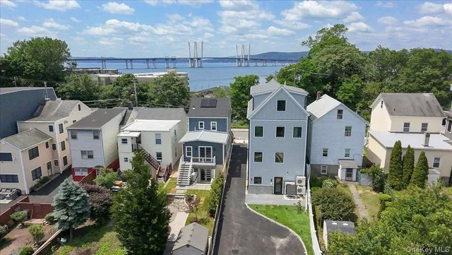 a aerial view of a house with a yard